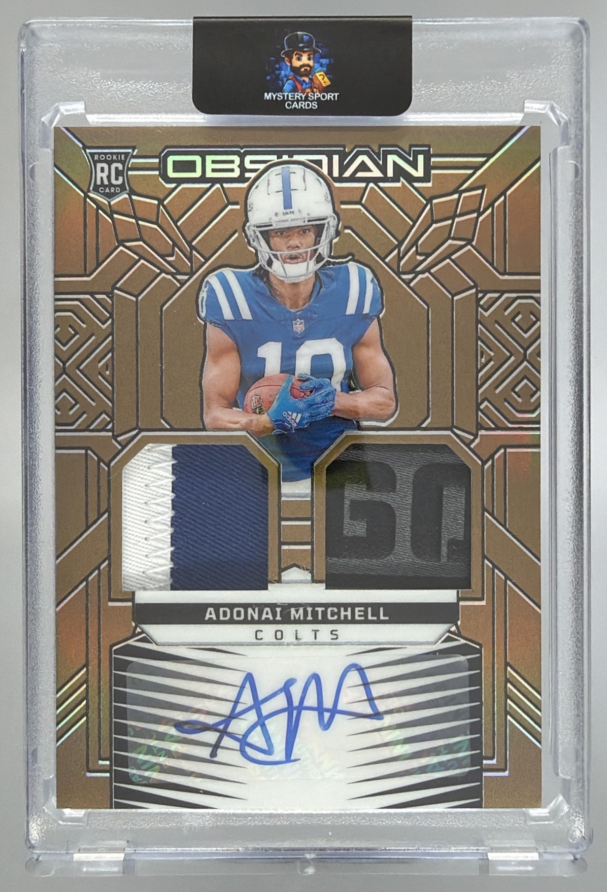 Card image for 2024 Panini Obsidian Adonai Mitchell Rookie Materials Ink Gold /10 #RMI-ADM RC Auto Colts