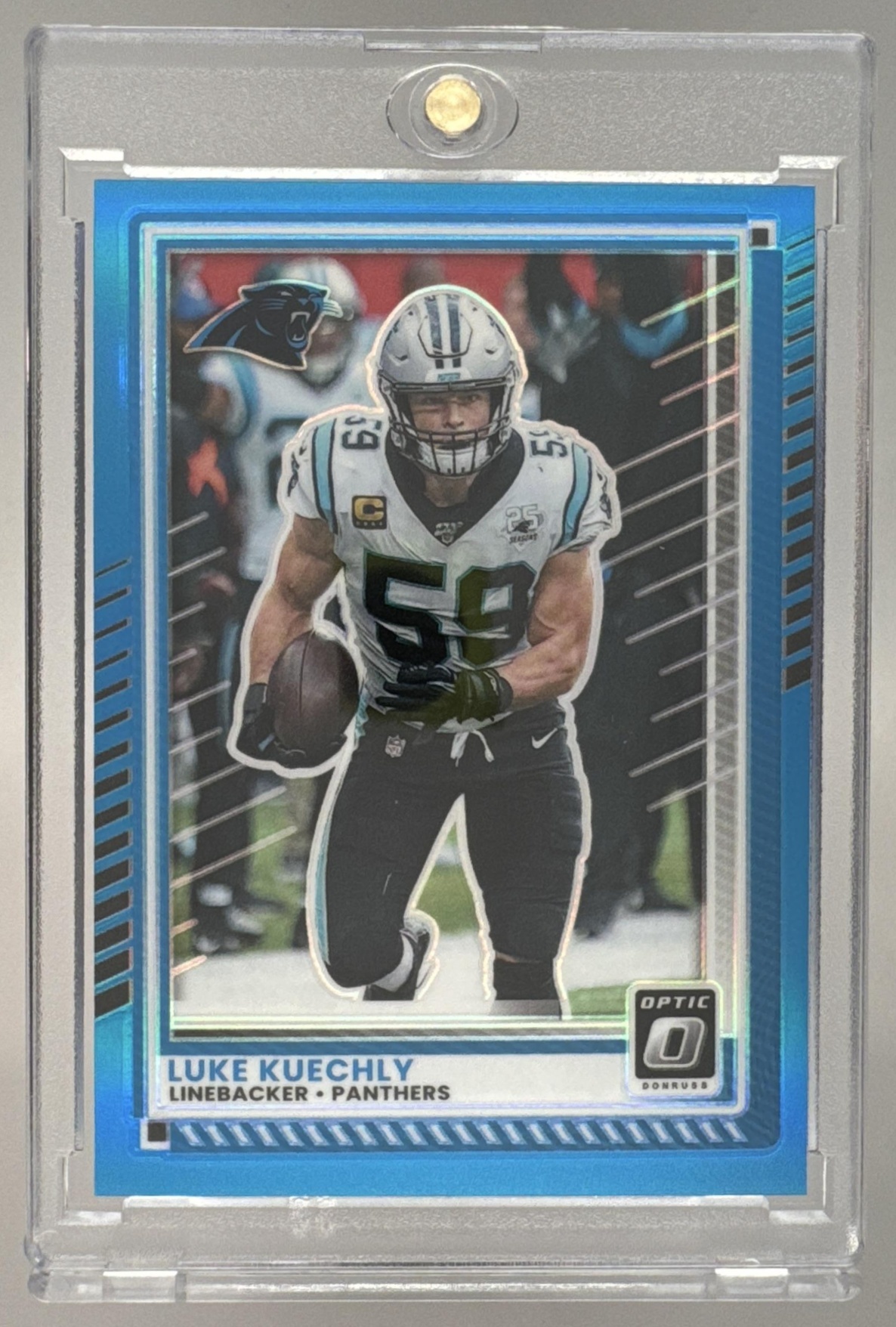 Card image for 2025 Panini Donruss Optic Luke Kuechly Neon Blue Prizm /399 #84 Panthers