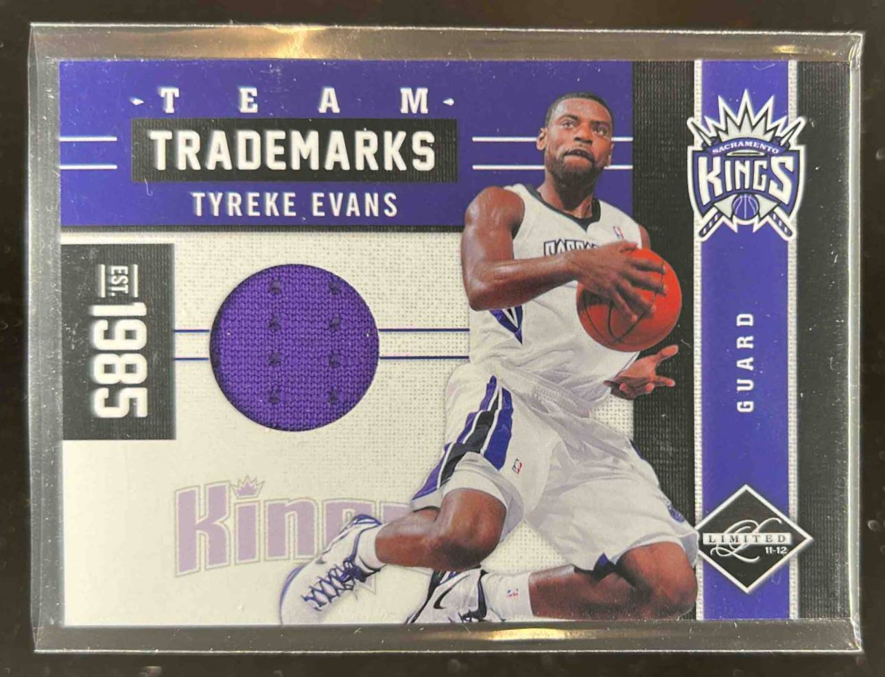 Card image for 2011-12 Panini Limited Tyreke Evans Team Trademarks Materials 77 /99 #6