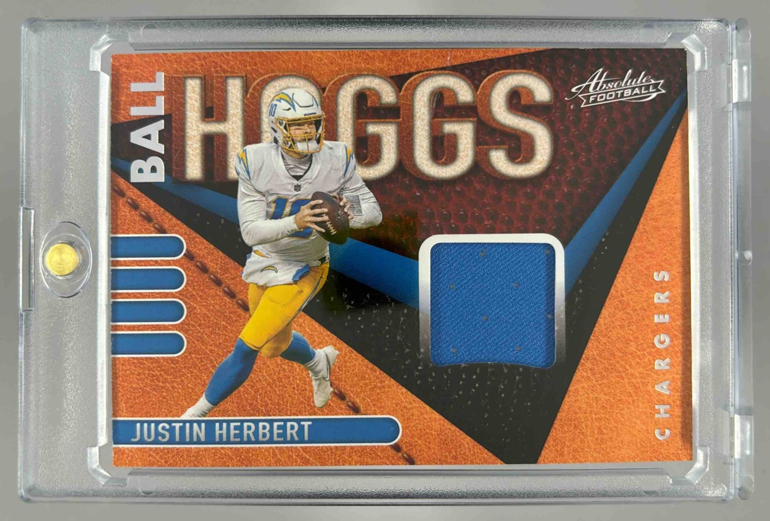 Card image for 2021 Panini Absolute Justin Herbert Ball Hoggs #BH1 MEM Chargers
