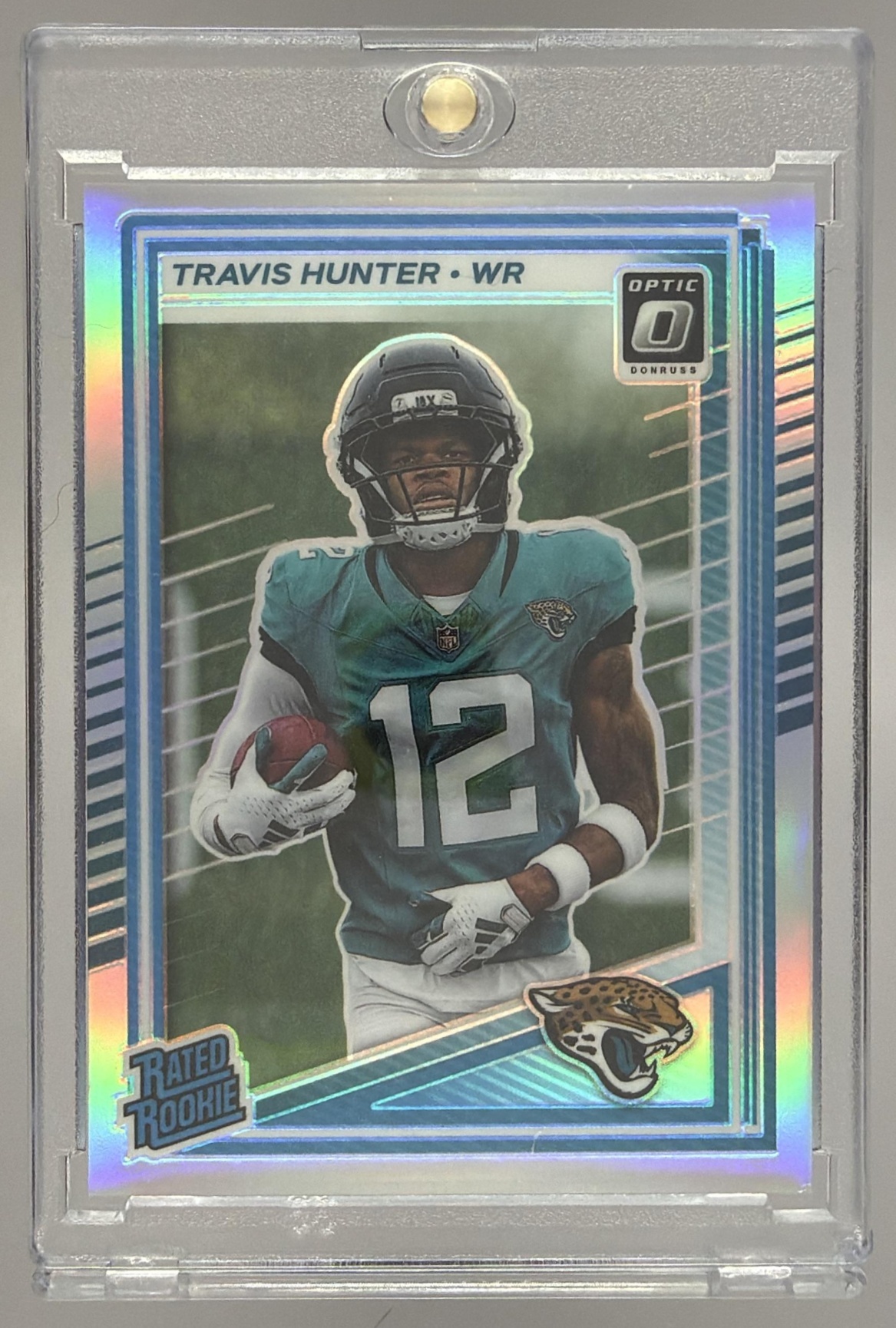 Card image for 2025 Panini Donruss Optic Travis Hunter Rated Rookie Green Hyper Prizm #201 Jaguars