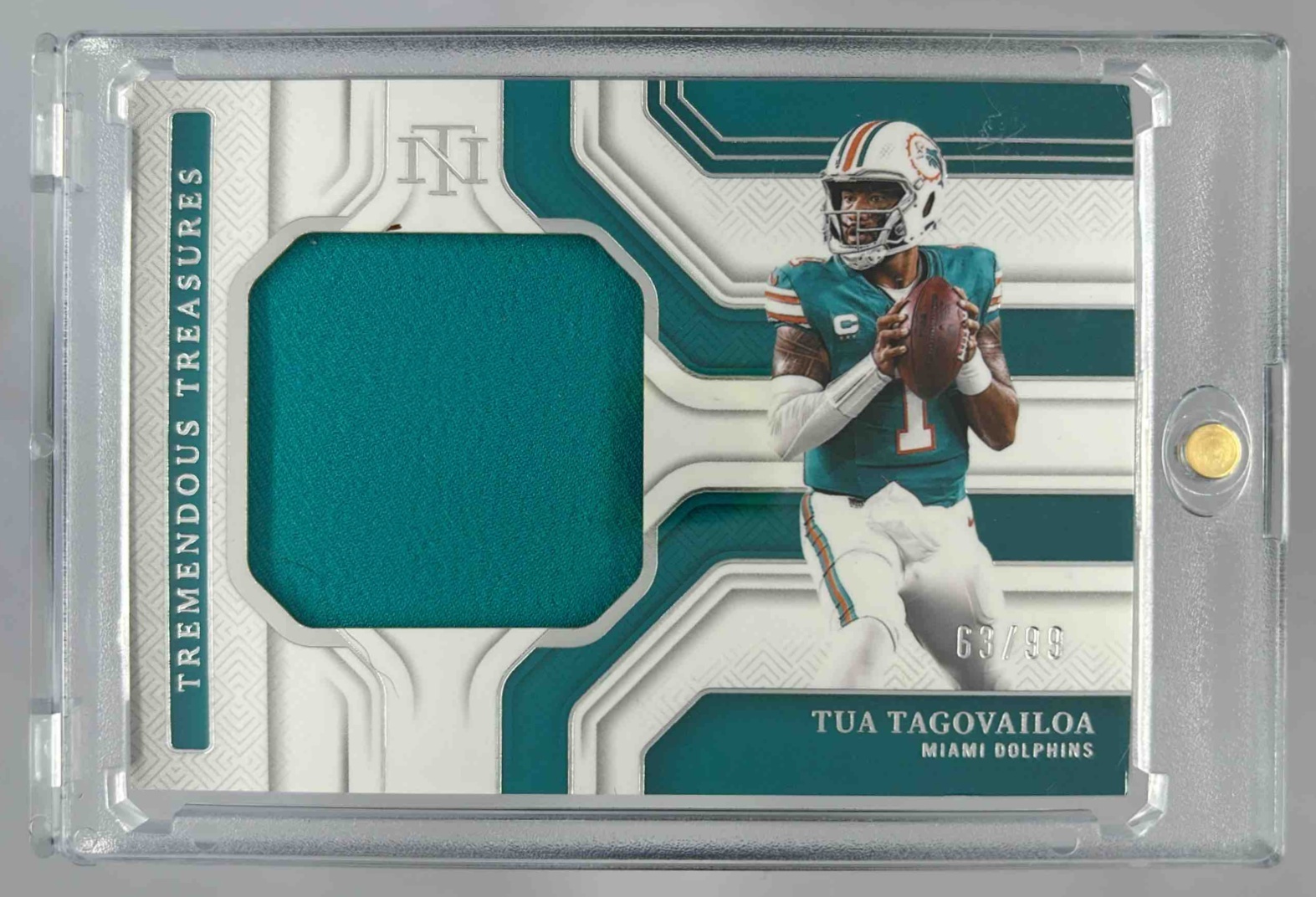 Card image for 2025 Panini National Treasures Tua Tagovailoa De'Von Achane Tyreek Hill NFL Gear Trio Materials /99 #14 MEM Dolphins