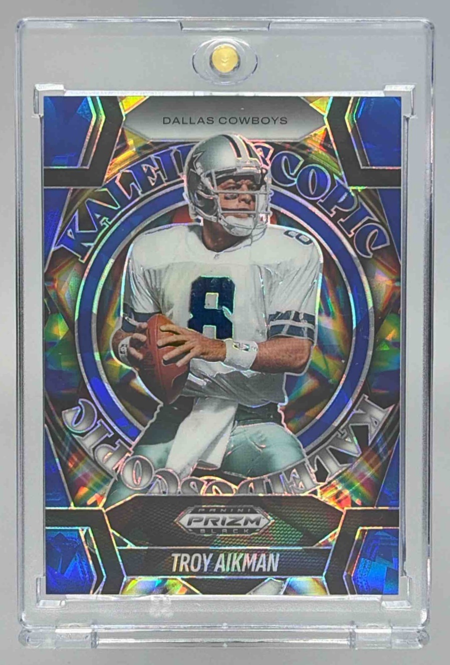 Card image for 2025 Panini Prizm Black Troy Aikman Kaleidoscopic Blue Ice /125 #23 Cowboys