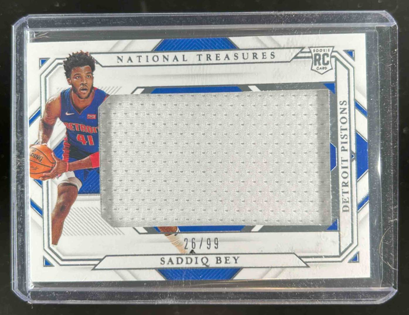Card image for 2020-21 Panini National Treasures Saddiq Bey Rookie Jumbo Materials 26 /99 #RMJ-SBY MEM RC