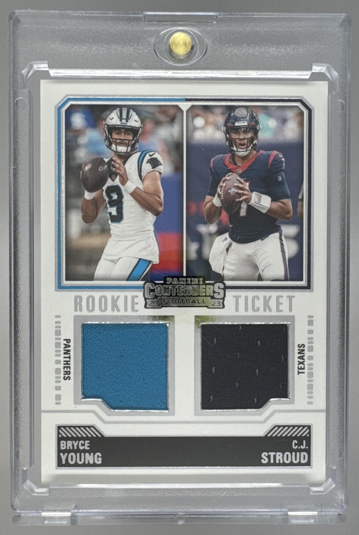 Card image for 2023 Panini Contenders Bryce Young C.J. Stroud Rookie Ticket Dual Swatches #DS-1 MEM RC Texans Panthers