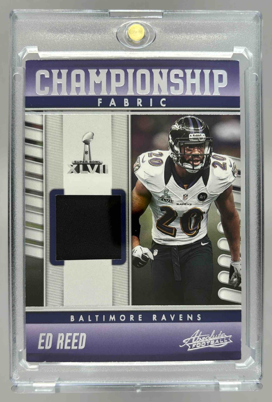 Card image for 2023 Panini Absolute Ed Reed Championship Fabric #CF-15 MEM Ravens