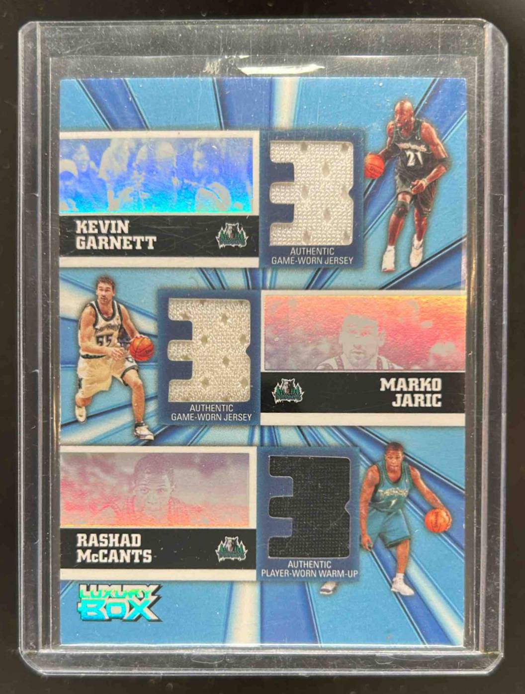 Card image for 2005-06 Topps Luxury Box Kevin Garnett / Marko Jaric Rashad McCants Trinity Triple Relics 105 /250 #TR-GJM