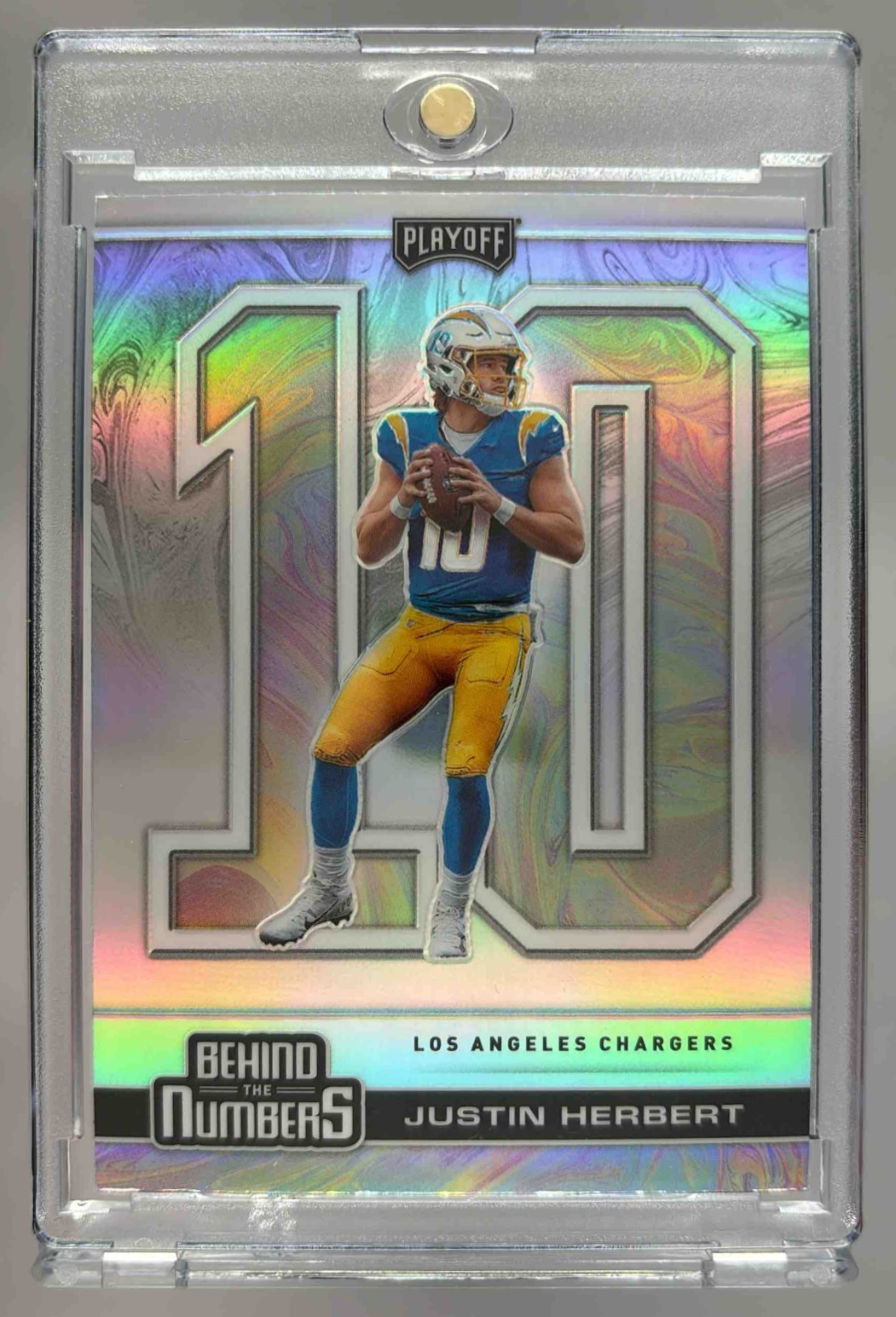 Card image for 2020 Panini Playoff Justin Herbert Behind the Numbers Silver #BTN-26 RC Chargers