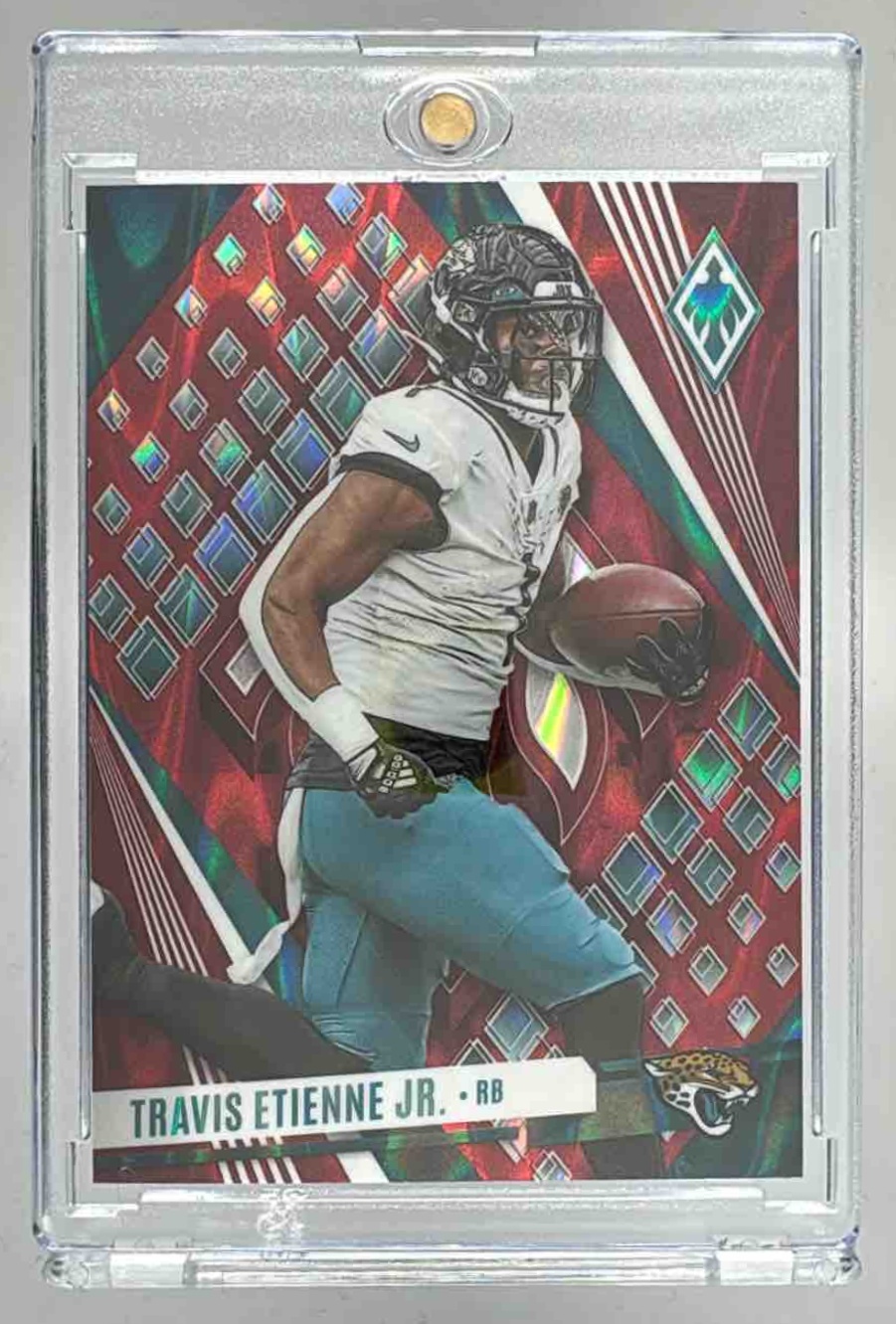Card image for 2023 Panini Phoenix Travis Etienne Jr. Red Seismic /199 #53b VAR Jaguars