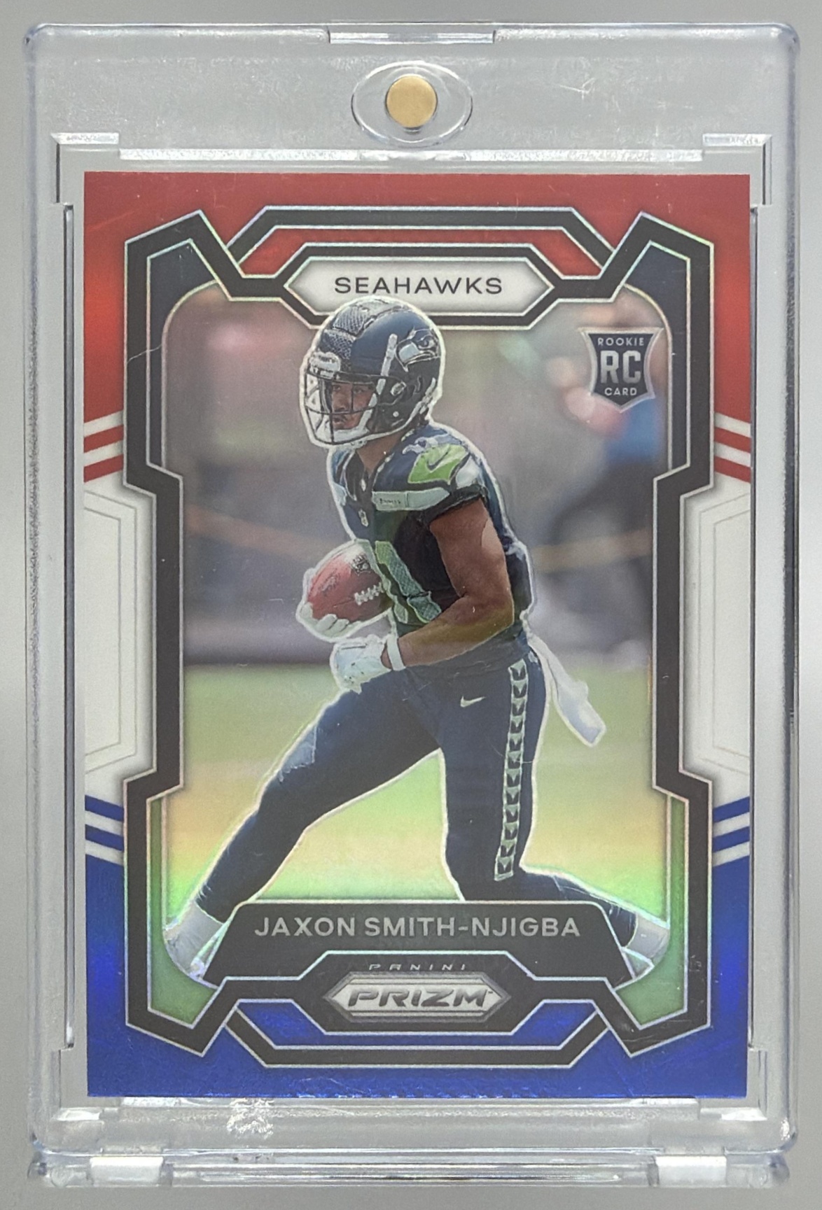 Card image for 2023 Panini Prizm Jaxon Smith-Njigba Red White and Blue #390 RC Seahawks