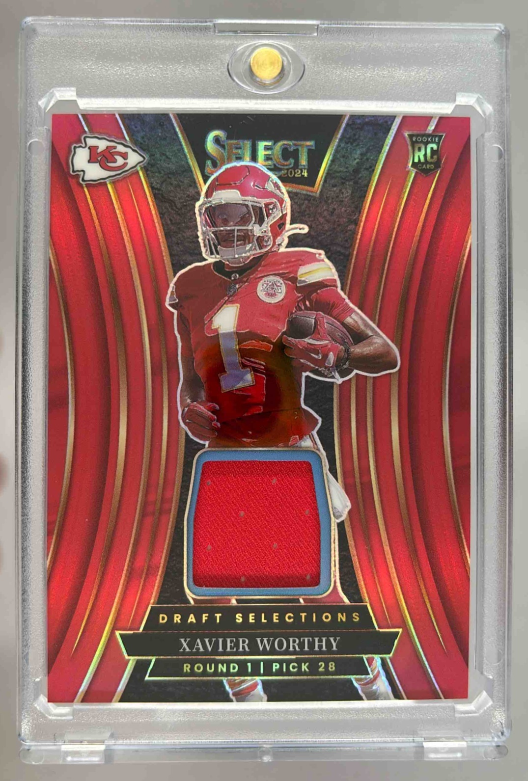 Card image for 2024 Panini Select Xavier Worthy Draft Selections Memorabilia Red Prizm #DSM-XWY MEM RC Chiefs