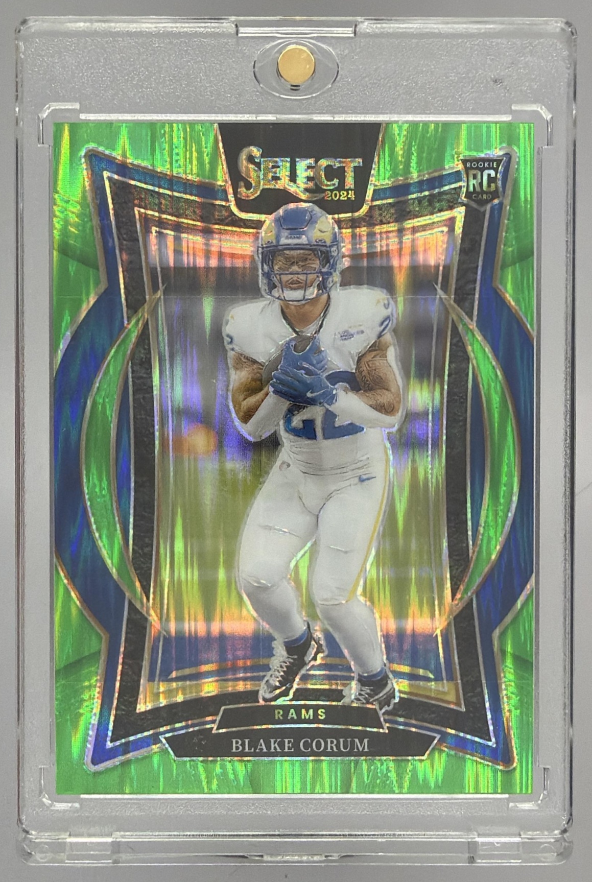 Card image for 2024 Panini Select Blake Corum Concourse Neon Green Prizm Shock /599 #9 RC Rams