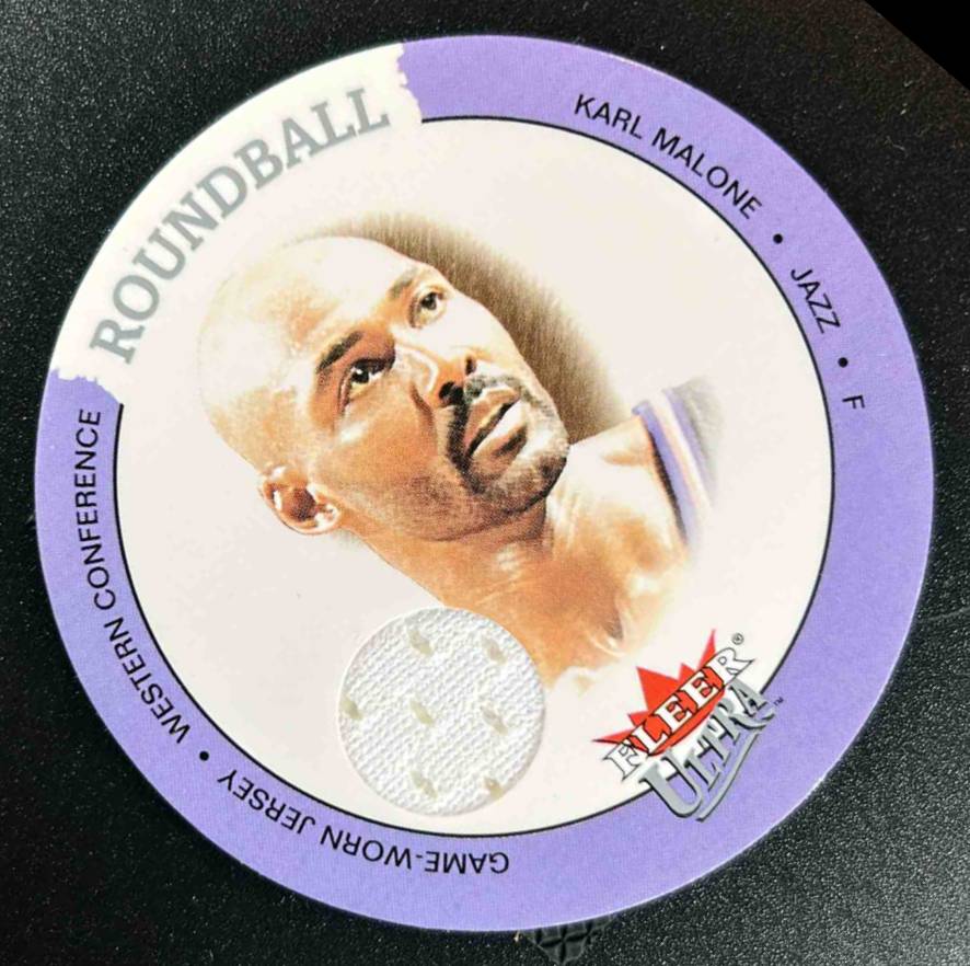 Card image for 2003-04 FLEER ULTRA KARL MALONE ROUNDBALL DISCS GAME USED #D-KM MEM UTAH JAZZ