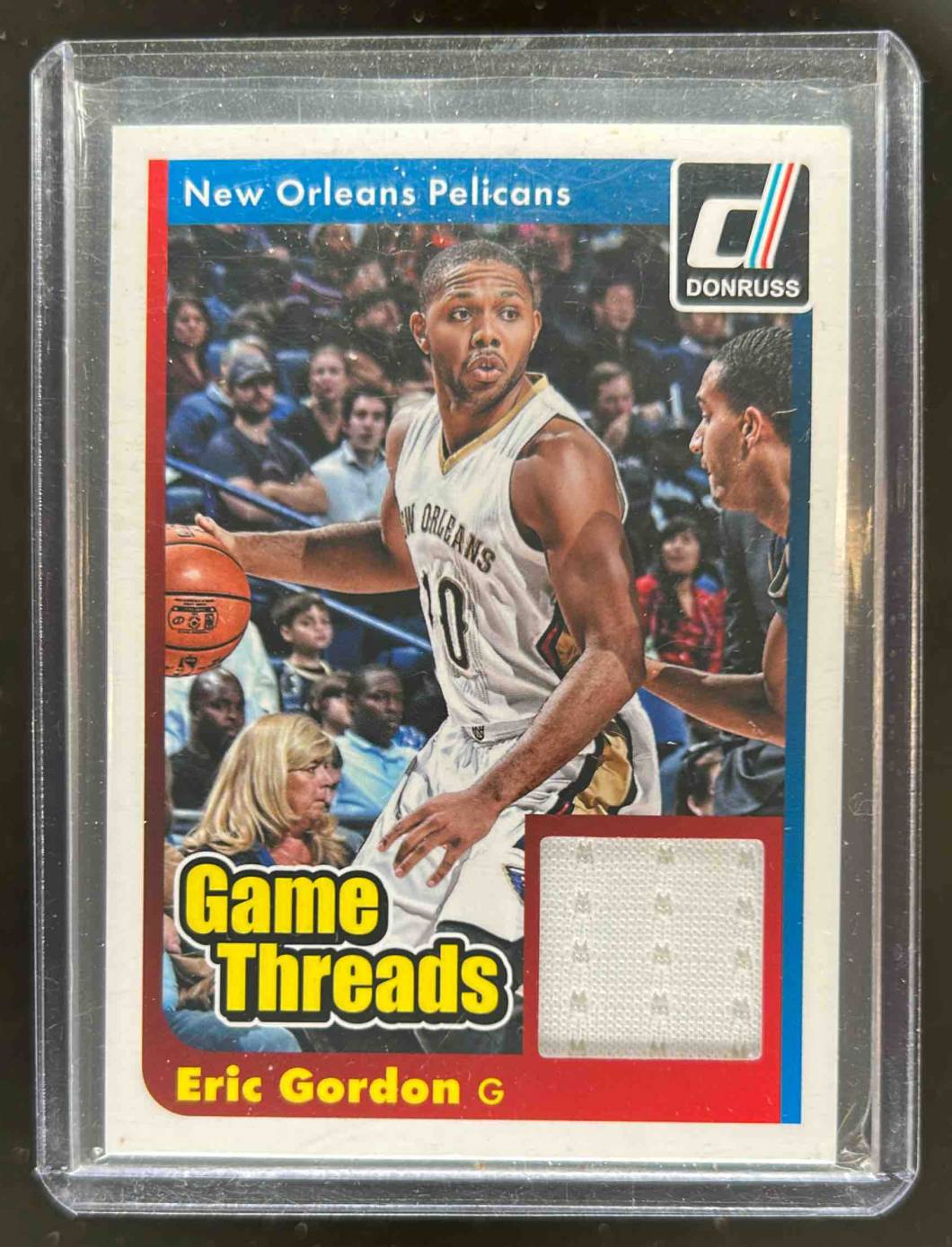 Card image for 2014-15 PANINI DONRUSS ERIC GORDON GAME THREADS #9 NEW ORLEANS PELICANS