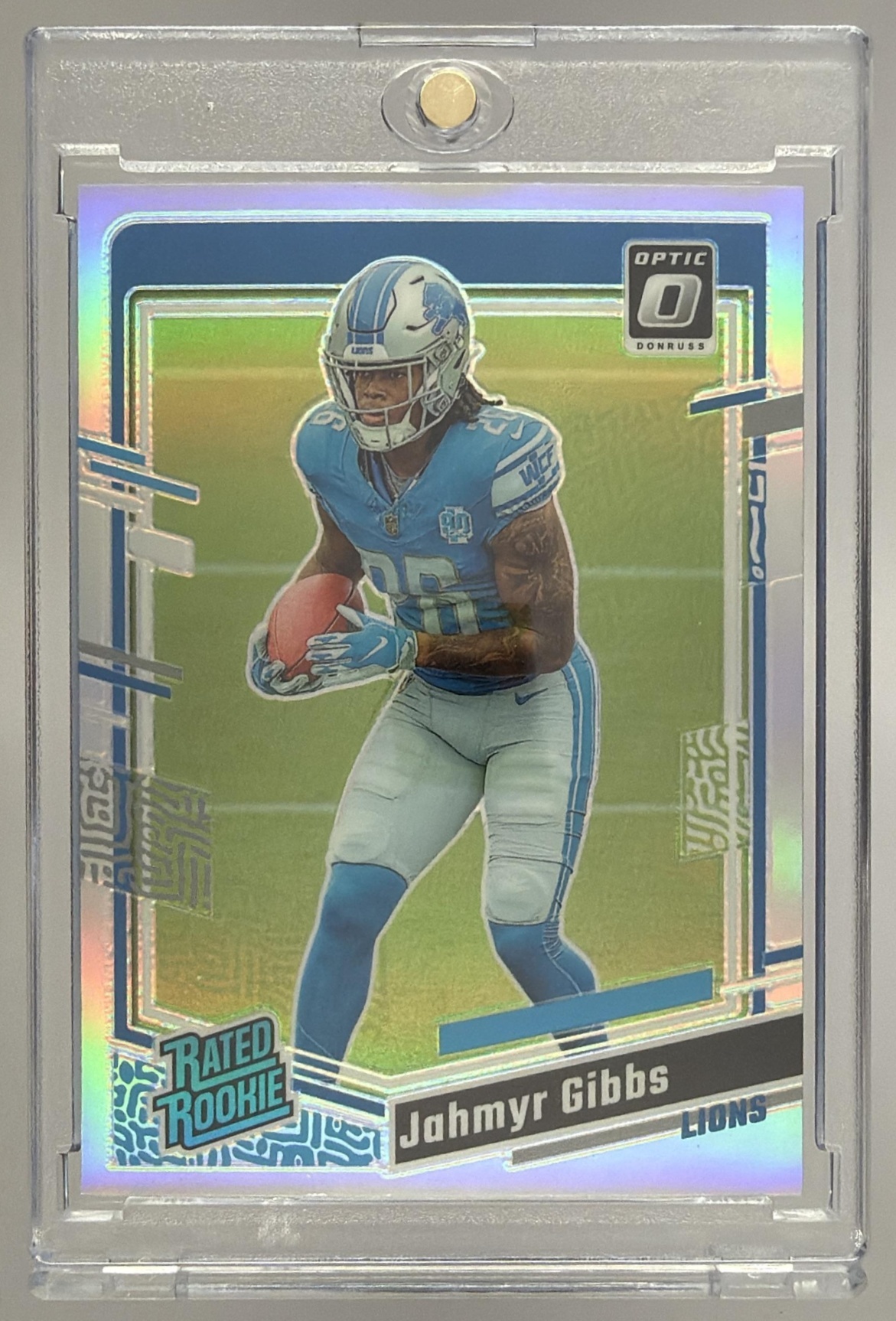Card image for 2023 Panini Donruss Optic Jahmyr Gibbs Blue Hyper Prizm #236 RC Rated Rookie Lions