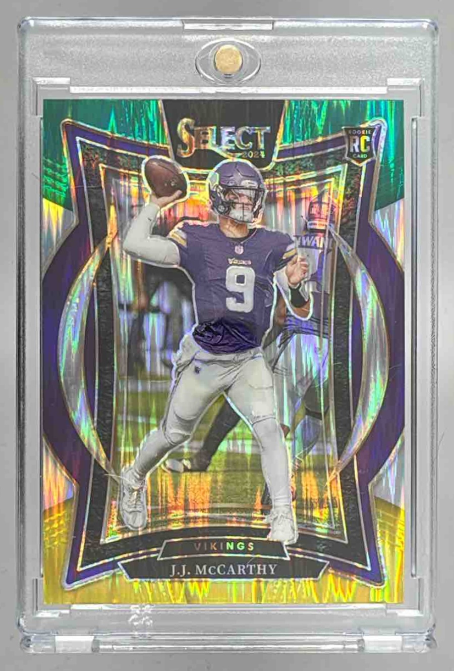 Card image for 2024 Panini Select J.J. McCarthy Concourse Green and Yellow Prizm Shock #24 RC Vikings