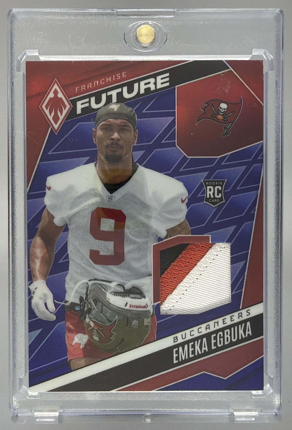 Card image for 2025 Panini Phoenix Emeka Egbuka Franchise Future Material Blue Prizm /199 #FFM-EEA MEM RC Buccaneers