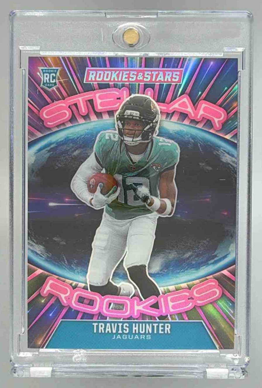 Card image for 2025 Panini Rookies & Stars Travis Hunter Stellar Pink /75 #2 RC Jaguars