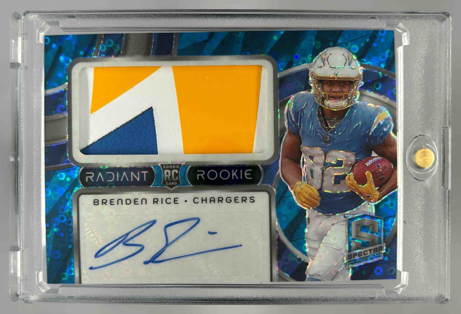 Card image for 2024 Panini Spectra Brenden Rice Radiant Rookie Patch Signatures Blue Neon /50 #RRP-BRE RC Auto Chargers