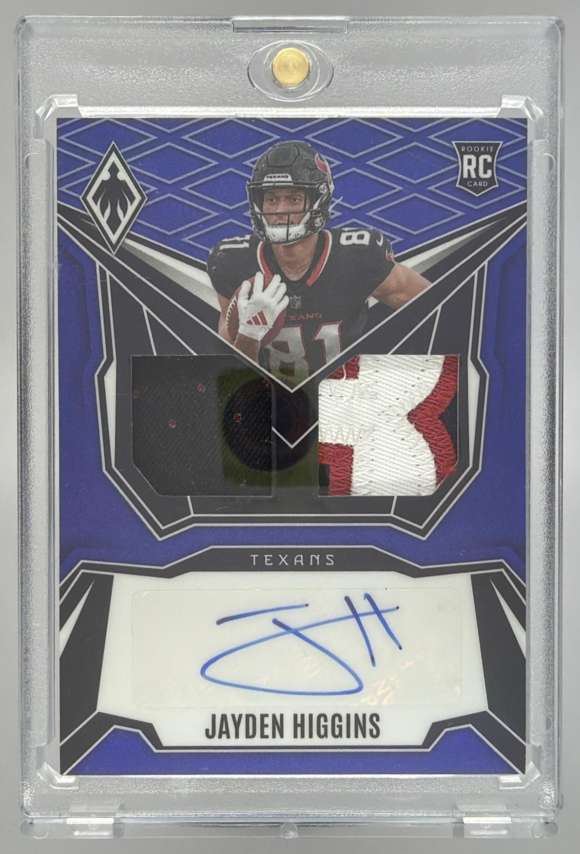 Card image for 2025 Panini Phoenix Jayden Higgins RPS Dual Rookie Patch Auto Blue Prizm /49 #DRP-JHS MEM RC Texans
