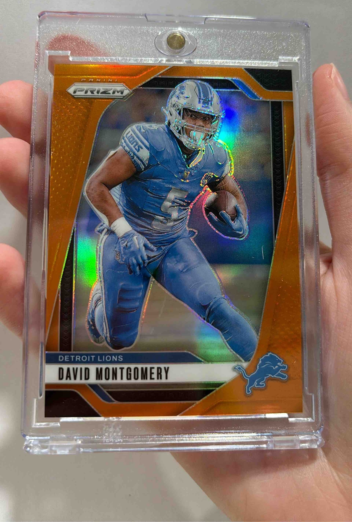 Card image for 2024 Panini Football Prizm David Montgomery Orange /249 #94 Detroit Lions