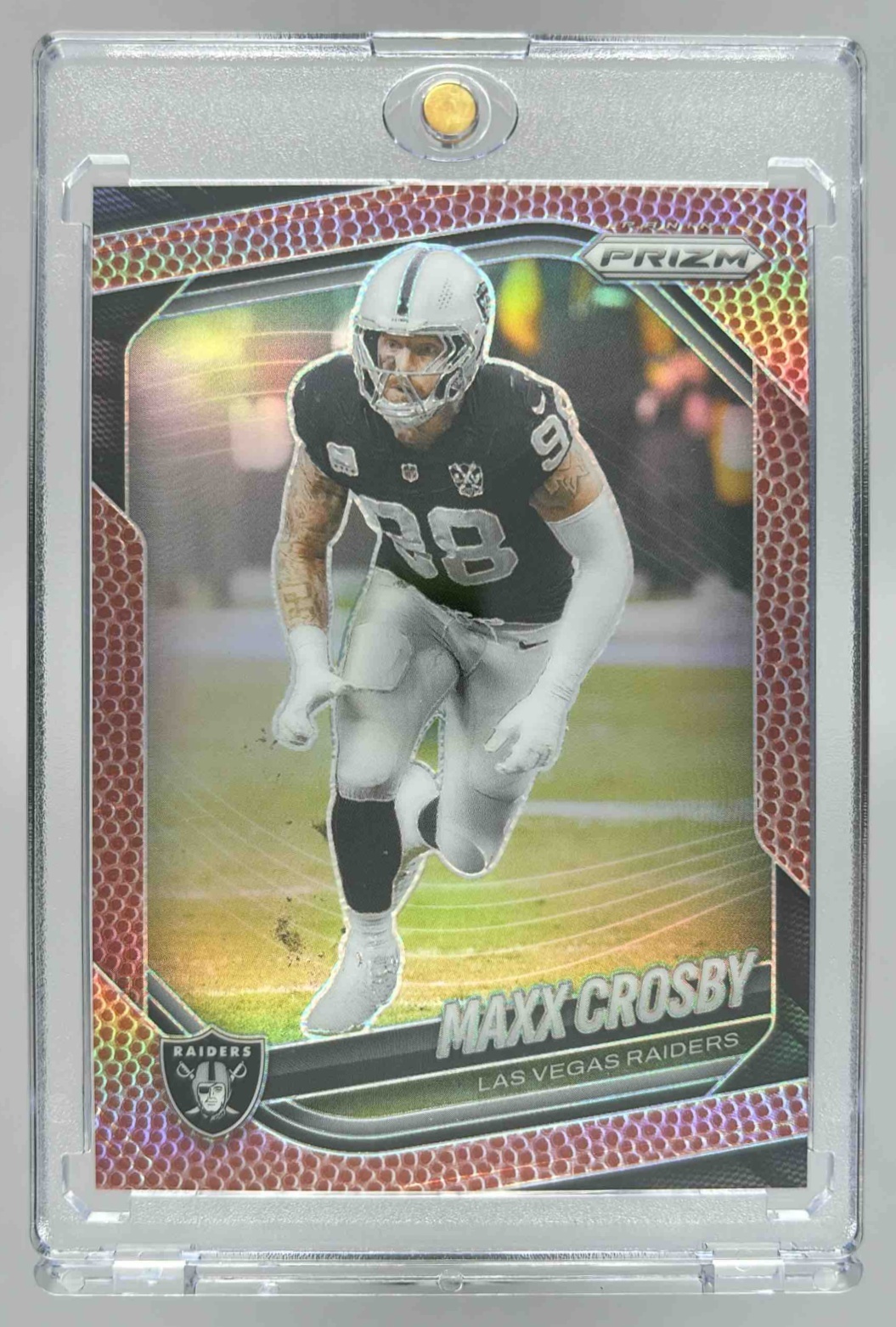 Card image for 2025 Panini Football Prizm Maxx Crosby Pigskin /180 #195 Las Vegas Raiders