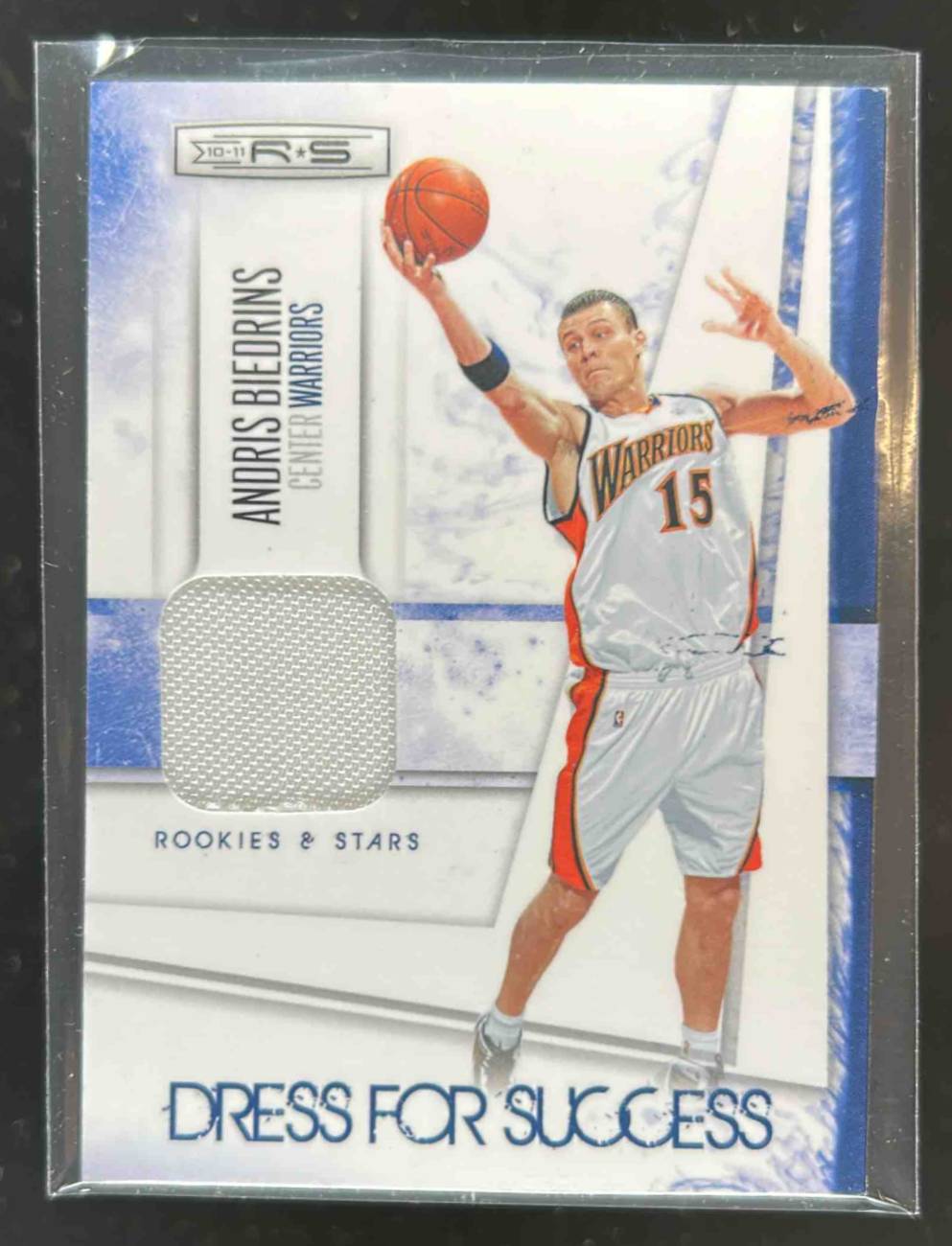 Card image for 2010-11 Panini Rookies & Stars Longevity Andris Biedrins Dress for Success Materials /299 #5